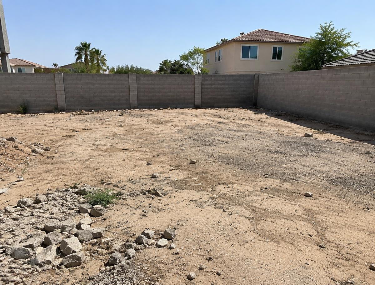 Bare sandy plot before garden development in Karachi